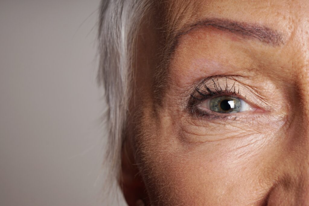 Close up detail of old woman with wrinkles around - McLean Eyecare Center